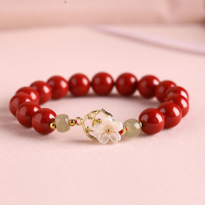 Braccialetto di benedizione con fiore di pietra di tridacna con perline di giada naturale di cinabro Buddha Stones