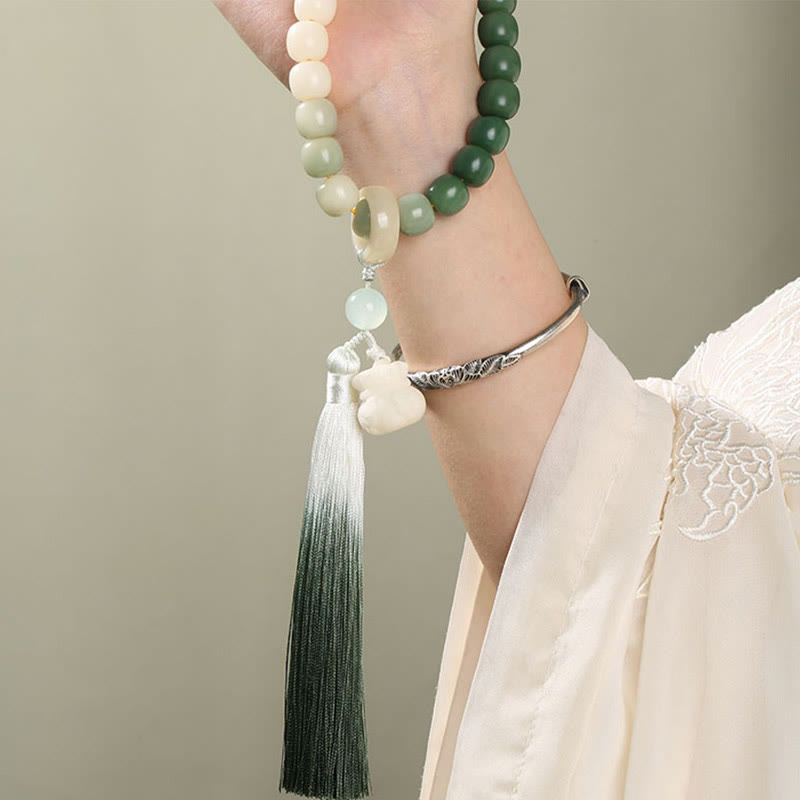 Buddha Stones Naturale Gradiente Bodhi Seed Fortuna Sacchetto di Denaro Loto Saggezza Nappa Polso Mala
