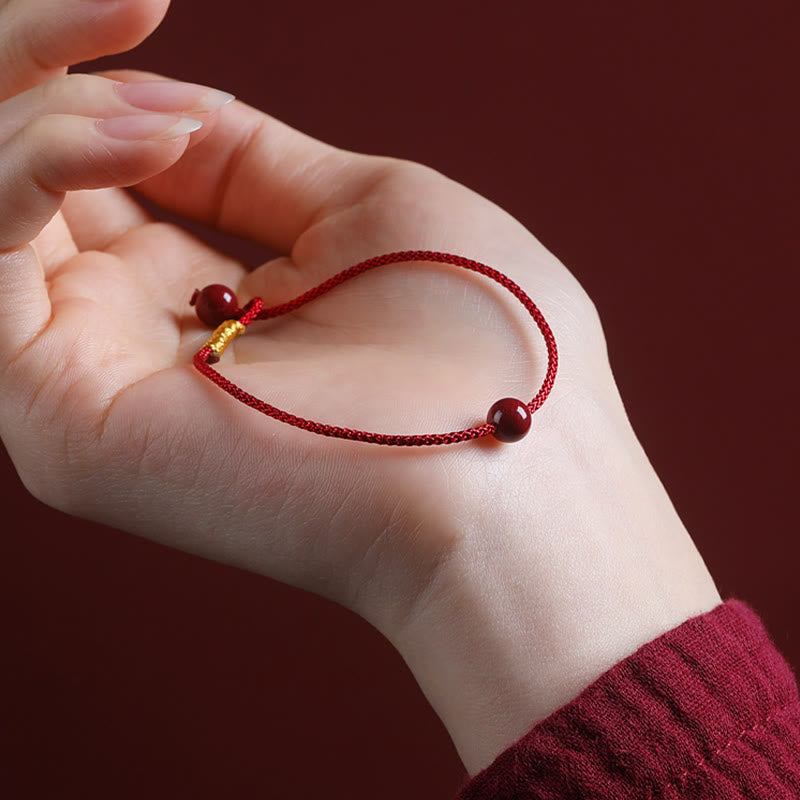 Braccialetto di corda rossa con benedizione in agata rossa naturale e cinabro Buddha Stones