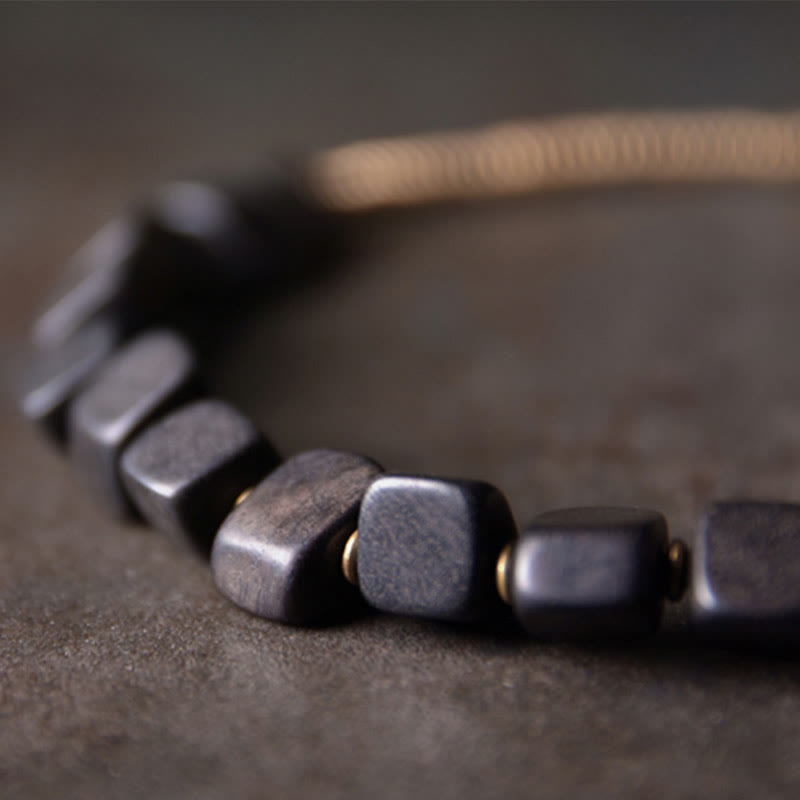 Braccialetto doppio giro in legno di ebano tibetano di Buddha Stones e rame