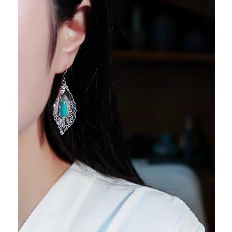 Orecchini pendenti con motivo a foglia di Bodhi in argento sterling 925 con Buddha Stones e turchese