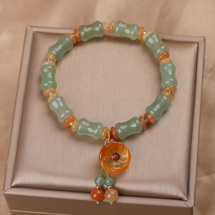 Braccialetto della fortuna con motivo a fiori di bambù e giada naturale Buddha Stones