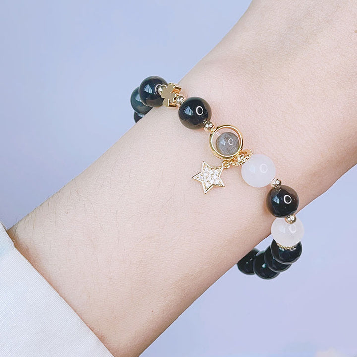 Braccialetto di protezione con cuore, stella e fiore in ossidiana naturale con Buddha Stones argento lucido
