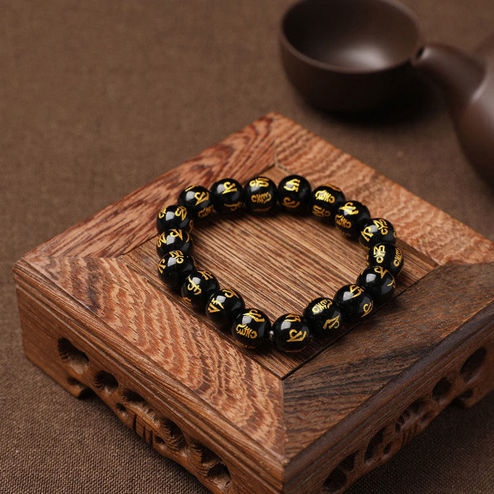 Braccialetto di meditazione Om Mani Padme Hum in onice nero e cristallo bianco del Tibet Buddha Stones