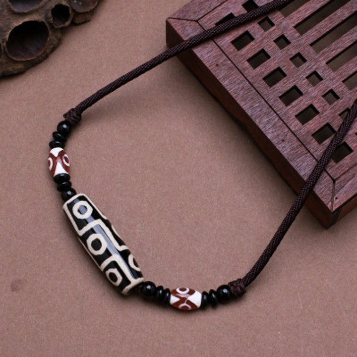Buddha Stones Collana di perline tibetane Dzi a nove occhi con cordino protettivo - Nero - image 1