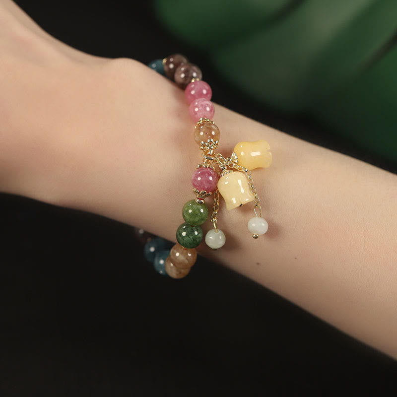 Braccialetto dell'amore con perline di fiori di tormalina colorata naturale Buddha Stones