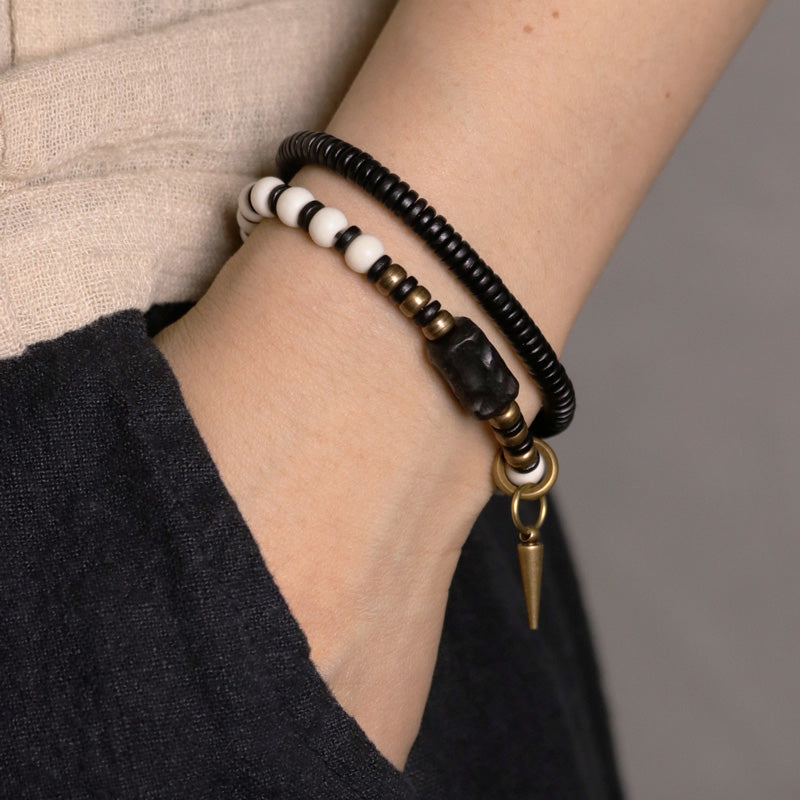 Braccialetto di coppia con perline di osso, ebano, Buddha Stones e rame