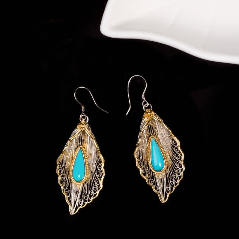 Orecchini pendenti con motivo a foglia di Bodhi in argento sterling 925 con Buddha Stones e turchese