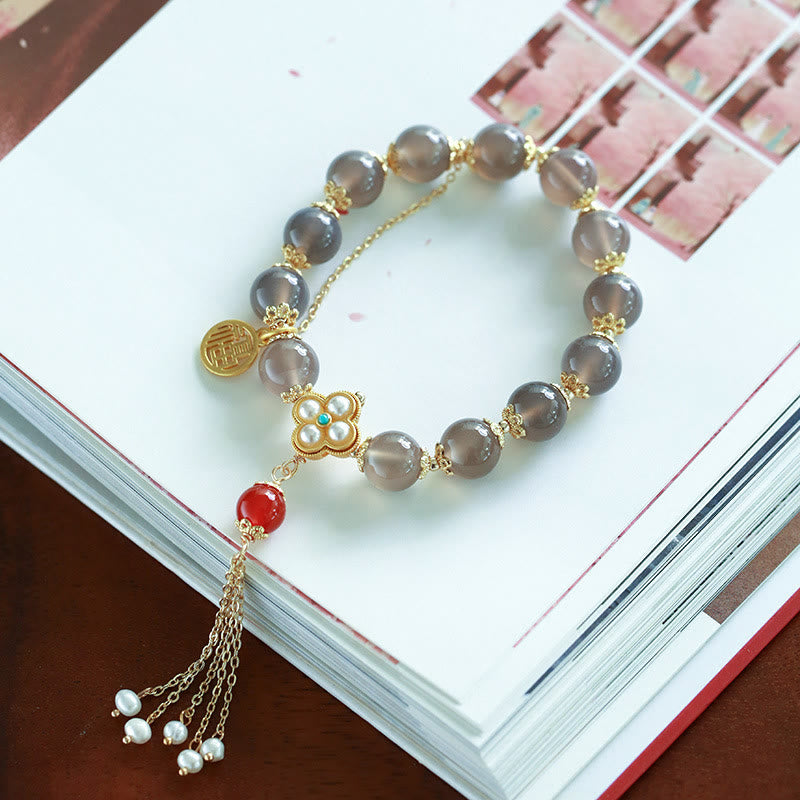 Braccialetto di equilibrio con nappa di perle di carattere Fu in agata grigia naturale Buddha Stones