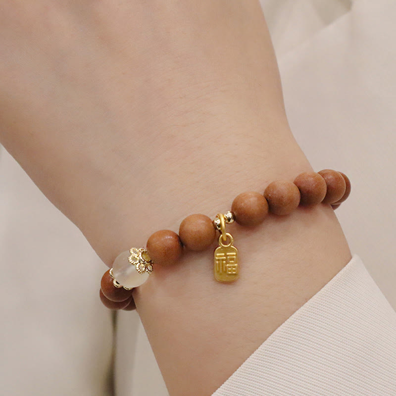 Braccialetto di protezione con ciondolo a forma di carattere Fu con occhio di gatto Buddha Stones in legno di sandalo