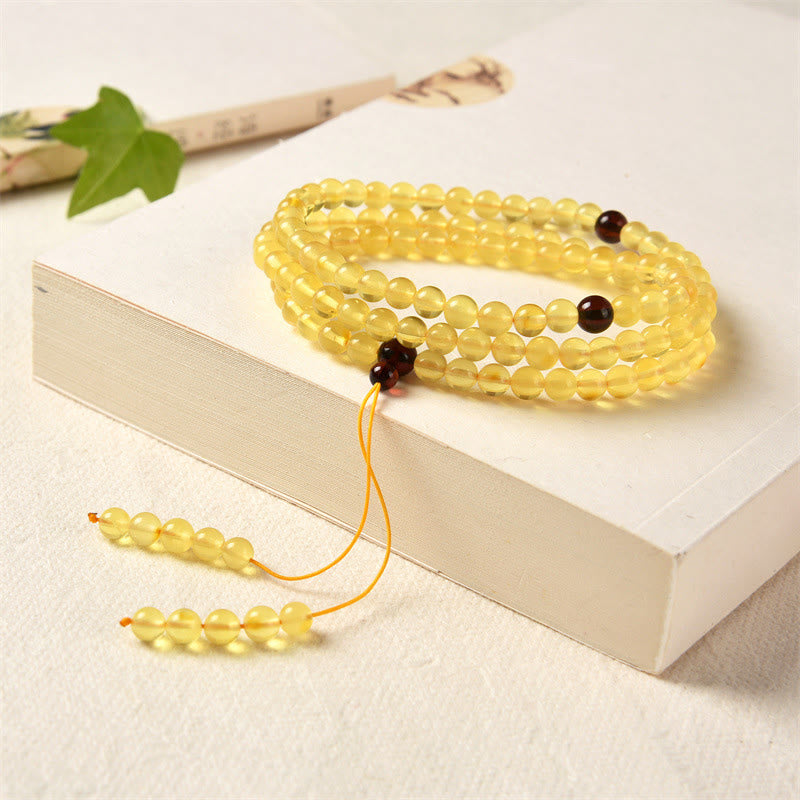 Braccialetto anti-ansia con 108 perline di mala in ambra naturale e trasparente Buddha Stones