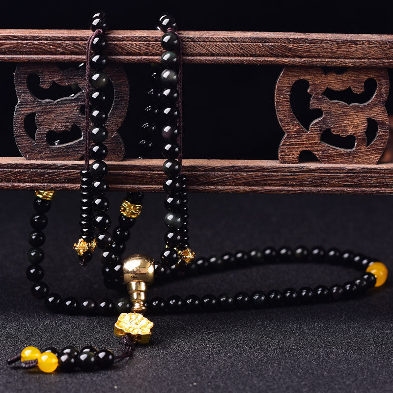 Braccialetto Mala Buddha Stones 108 perle in ossidiana nera naturale Lotus Fulfilment