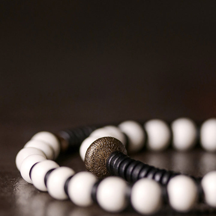 Braccialetto di coppia con perline di osso, ebano, Buddha Stones e rame