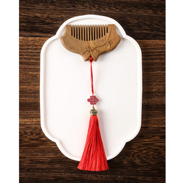 Pettine lenitivo inciso con motivo floreale in legno di sandalo verde Buddha Stones