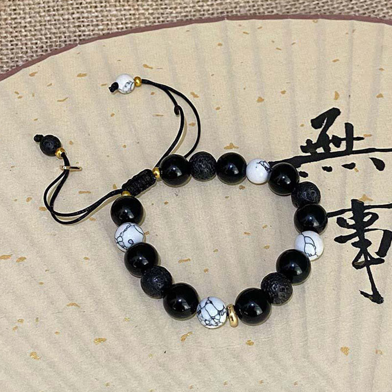 Braccialetto di forza Yin Yang in pietra lavica di ossidiana nera Buddha Stones