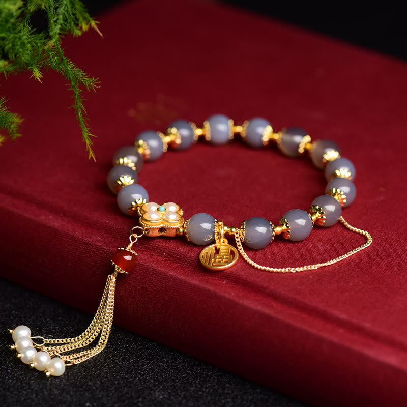 Braccialetto di equilibrio con nappa di perle di carattere Fu in agata grigia naturale Buddha Stones
