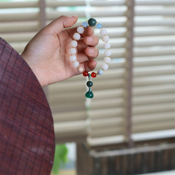 Braccialetto di armonia di pace intagliato con Buddha Stones