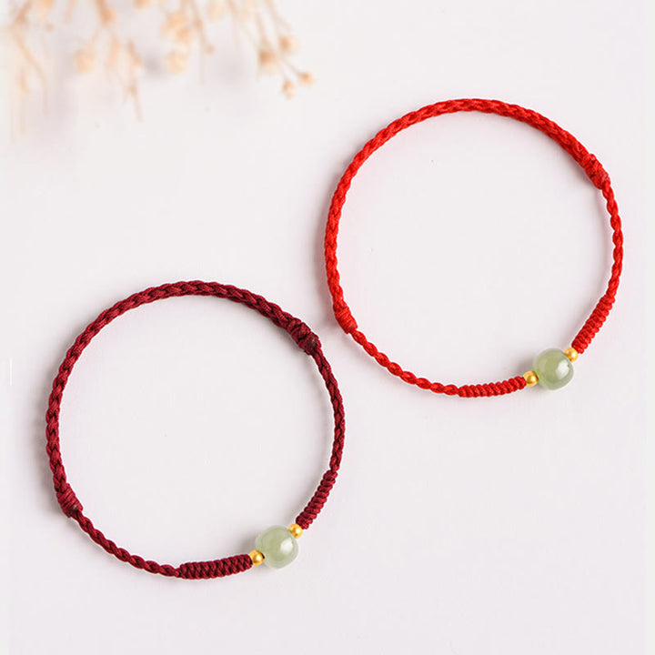Bracciale intrecciato con Buddha Stones e portafortuna