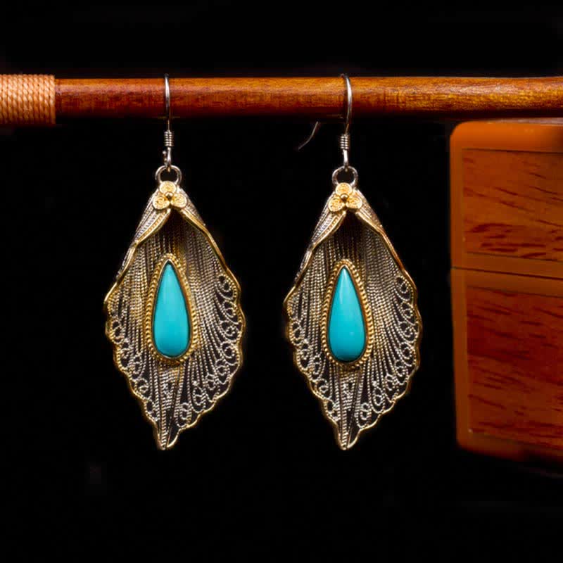 Orecchini pendenti con motivo a foglia di Bodhi in argento sterling 925 con Buddha Stones e turchese