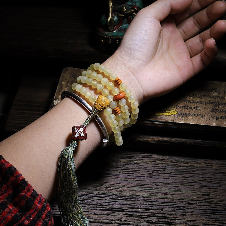 Braccialetto della fortuna in ambra e corno di pecora del Tibet con 108 perle di Mala Buddha Stones