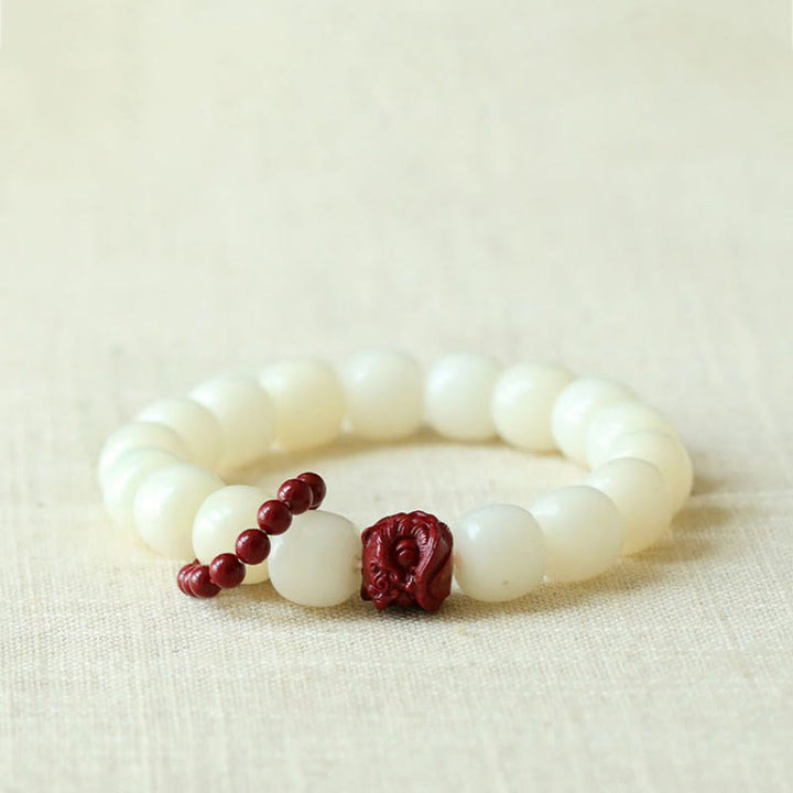 Buddha Stones Semi di Bodhi naturale Cinabro Leone danzante Charm Saggezza Armonia Polso Mala - Seme di Bodhi (Saggezza♥ Tieni lontani gli spiriti maligni) - image 0