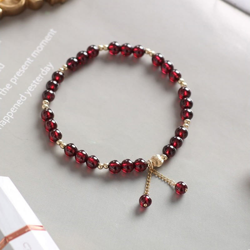 Bracciale Buddha Stones in lega placcata oro 14K con granato naturale e calma - image 2