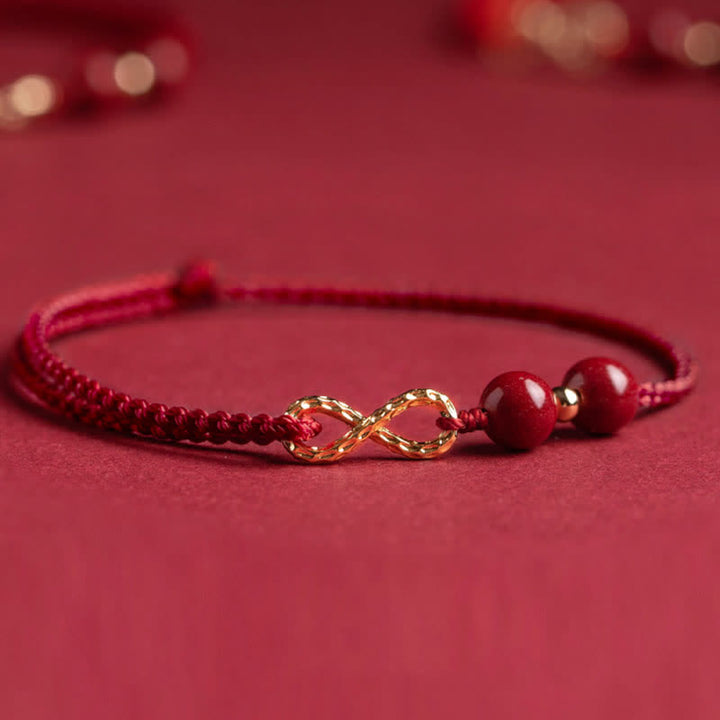 Braccialetto alla cavigliera con simbolo dell'infinito dorato e cordino rosso con Buddha Stones e cinabro. - image 6