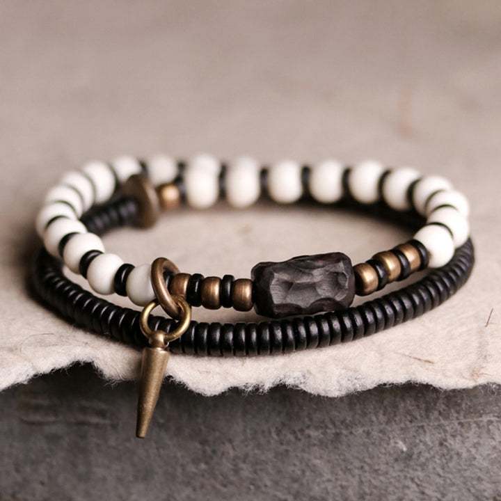 Braccialetto di coppia con perline di osso, ebano, Buddha Stones e rame