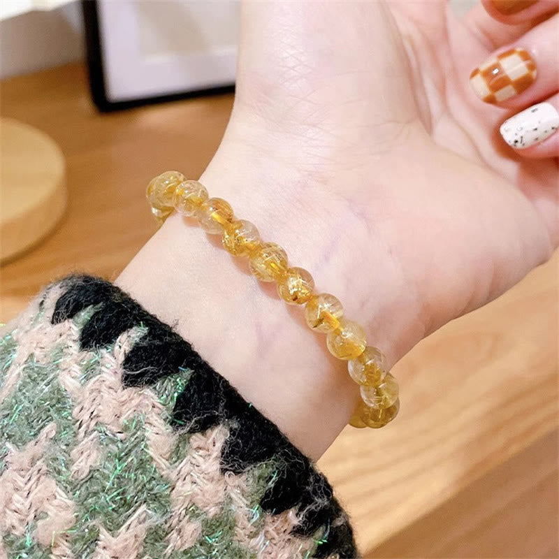 Bracciale Buddha Stones in oro naturale, quarzo rutilato, pietra del sole, cianite, ricchezza