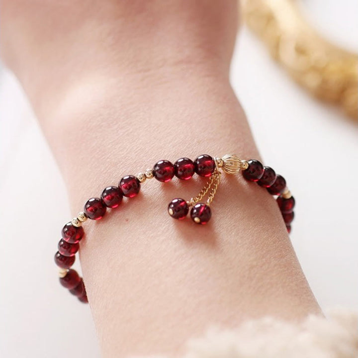 Bracciale Buddha Stones in lega placcata oro 14K con granato naturale e calma - image 8