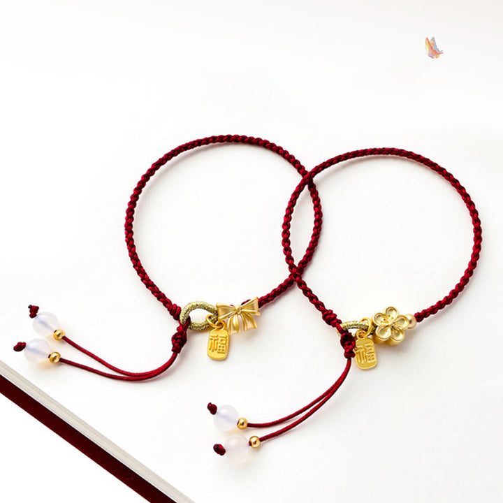 Braccialetto con corda rossa con ciondolo a forma di fiocco con rosetta in fiore di pesco fatto a mano con carattere Fu e nodo Buddha Stones