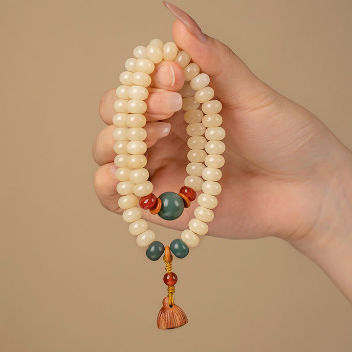 Braccialetto doppio giro Buddha Stones Bodhi Seed Lotus Baccello Charm Peace
