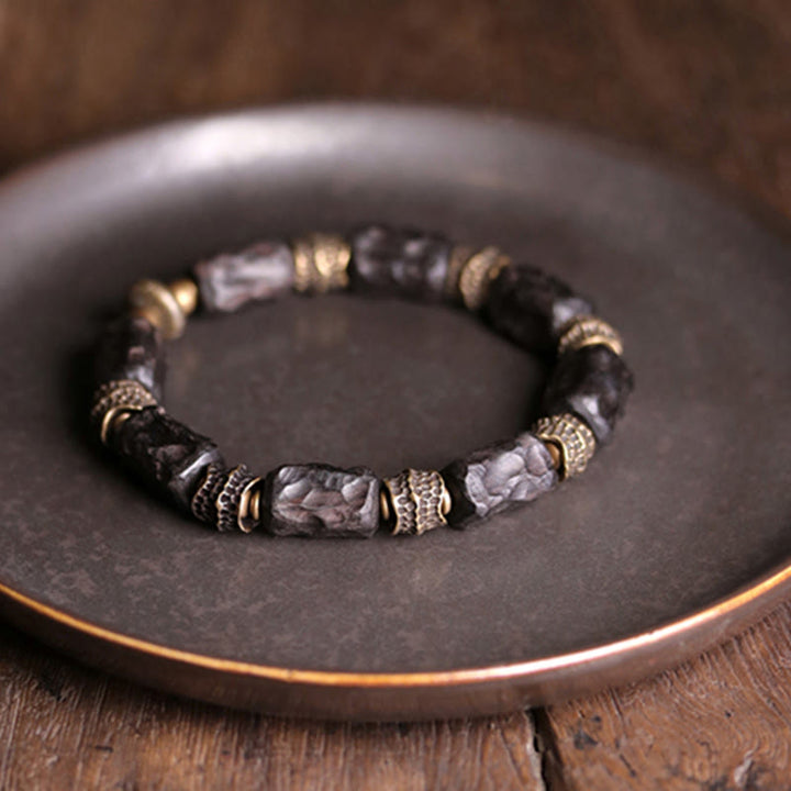 Braccialetto Buddha Stones Tibetano Ebano Legno Rame Calma Pace
