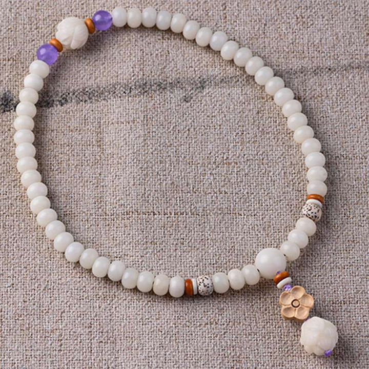 Braccialetto di benedizione del loto Bodhi in giada bianca tibetana Buddha Stones