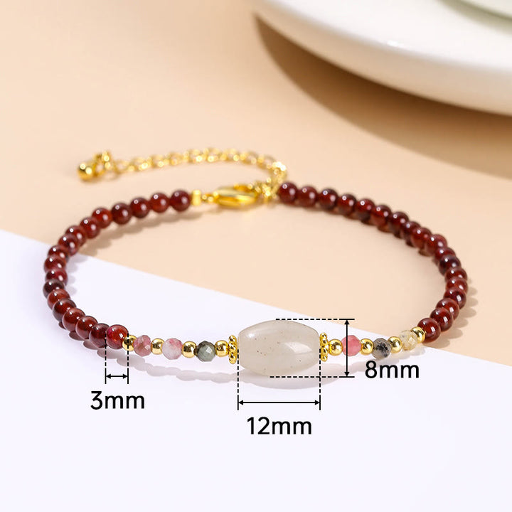 Bracciale Buddha Stones con perline di giada, tormalina e granato
