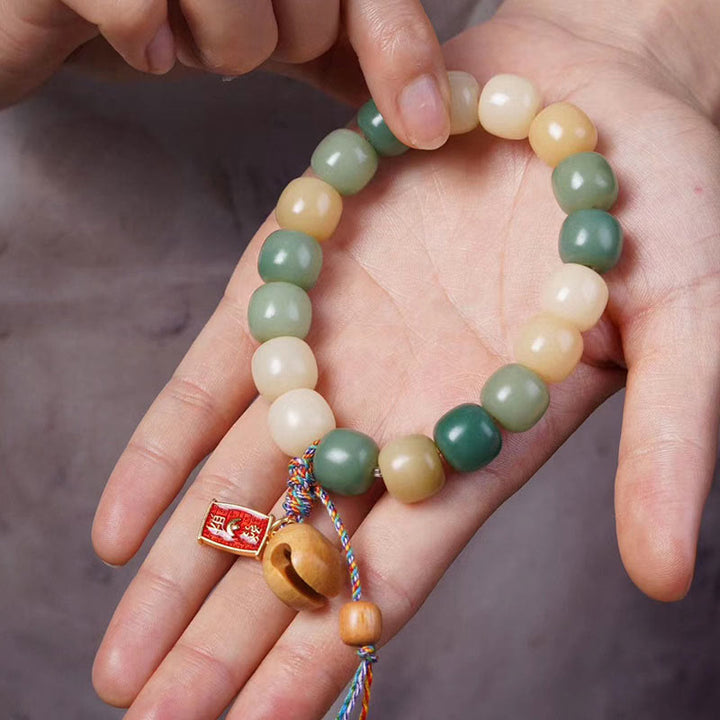 Braccialetto con ciondolo a tamburo di pesce in legno con semi di Bodhi e Buddha Stones, sfumatura naturale