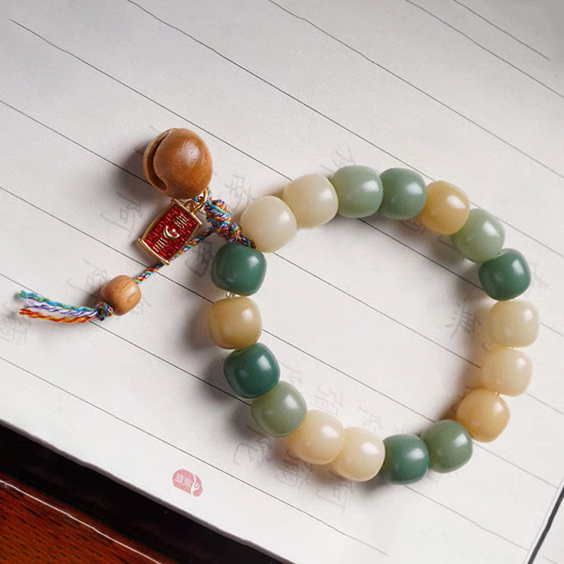 Braccialetto con ciondolo a tamburo di pesce in legno con semi di Bodhi e Buddha Stones, sfumatura naturale