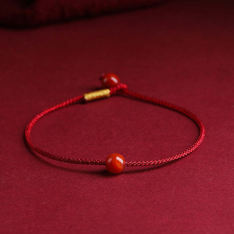 Braccialetto di corda rossa con benedizione in agata rossa naturale e cinabro Buddha Stones