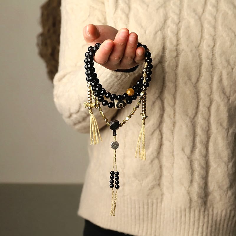 Buddha Stones Tibetano 108 Mala Beads Onice Nero Tre Occhi Dzi Beads Bracciale di Protezione - image 1