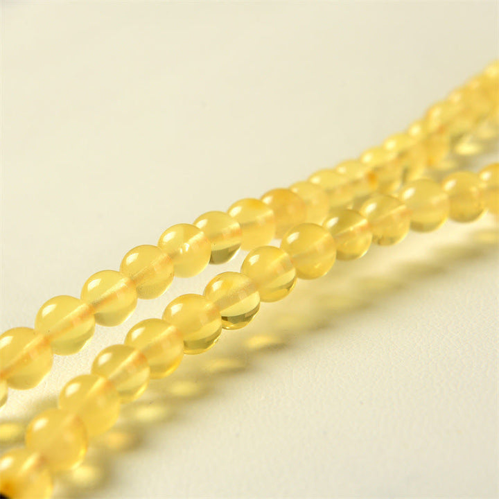 Braccialetto anti-ansia con 108 perline di mala in ambra naturale e trasparente Buddha Stones