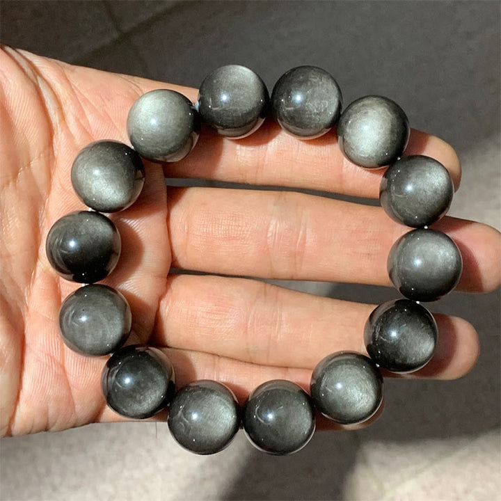 Braccialetto di protezione lenitiva in ossidiana lucida d'argento naturale Buddha Stones