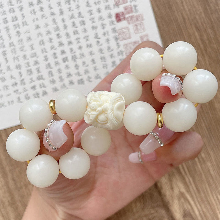 Braccialetto di protezione con leone danzante , Buddha Stones di avorio, seme di Bodhi, pietre di Buddha, argento lucido e ossidiana