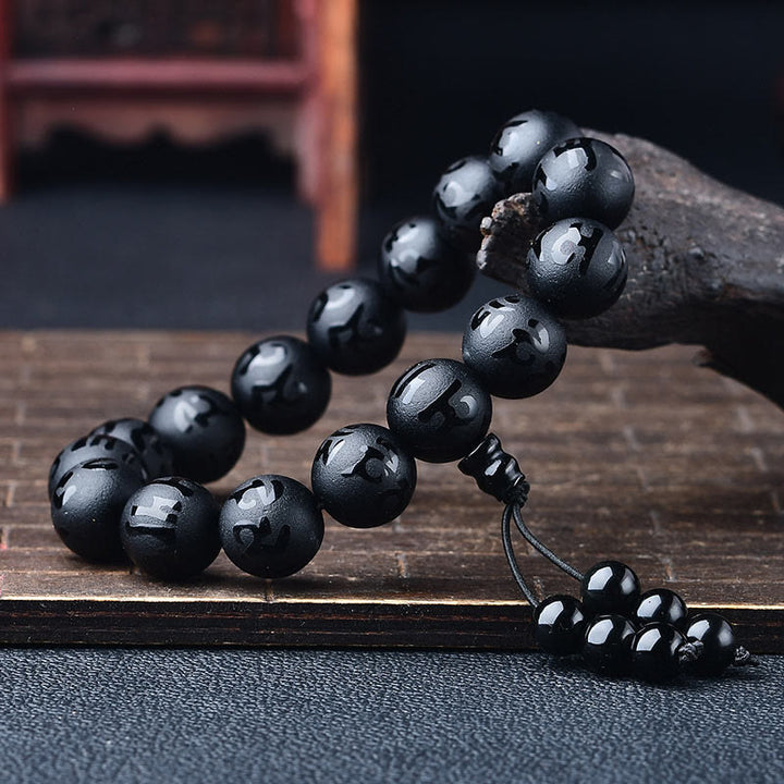 Braccialetto di meditazione Om Mani Padme Hum in onice nero e cristallo bianco del Tibet Buddha Stones