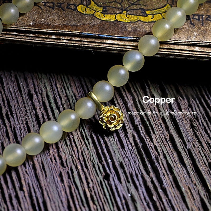 Braccialetto della fortuna in ambra e corno di pecora del Tibet con 108 perle di Mala Buddha Stones