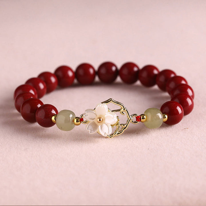 Braccialetto di benedizione con fiore di pietra di tridacna con perline di giada naturale di cinabro Buddha Stones