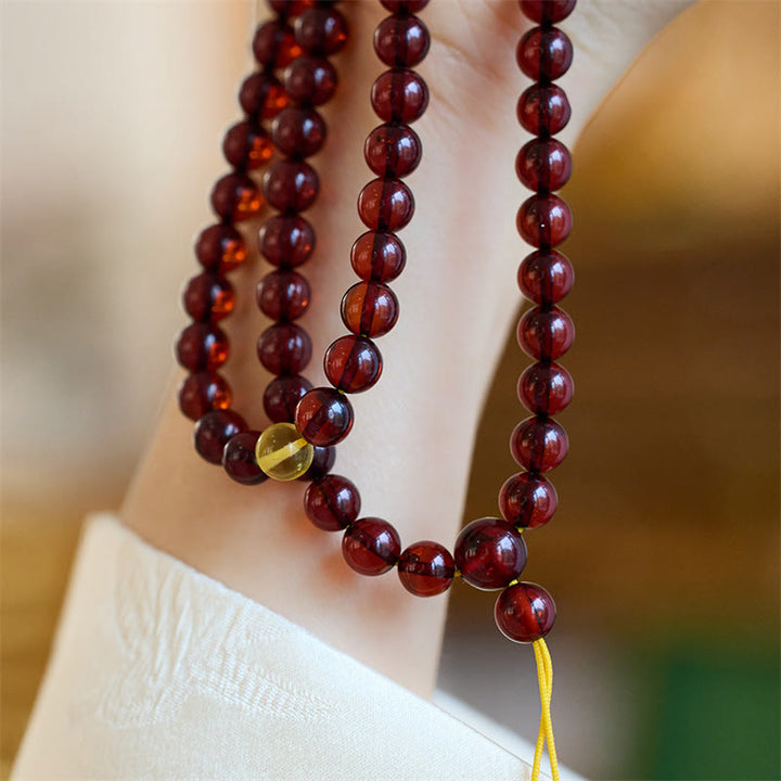 Braccialetto anti-ansia in ambra trasparente con 108 perle di Mala naturali Buddha Stones
