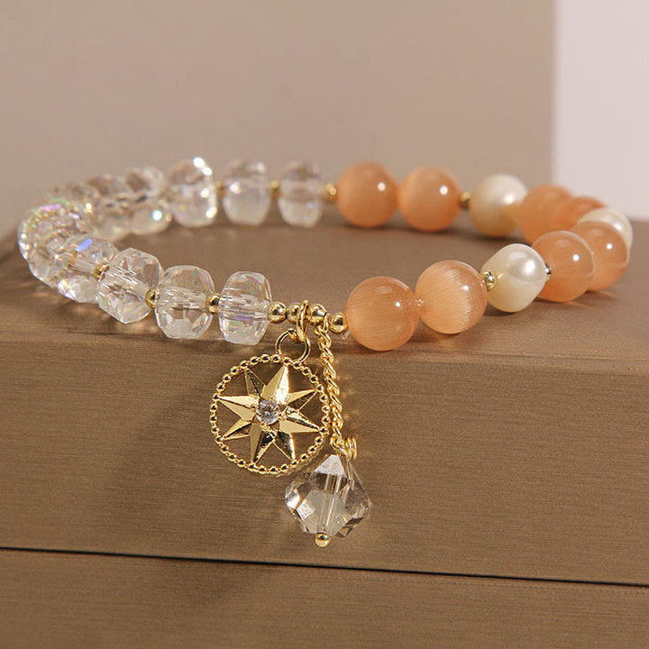 Braccialetto di supporto con stella di cristallo bianco e occhio di gatto arancione Buddha Stones