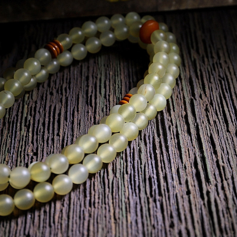 Braccialetto della fortuna in ambra e corno di pecora del Tibet con 108 perle di Mala Buddha Stones