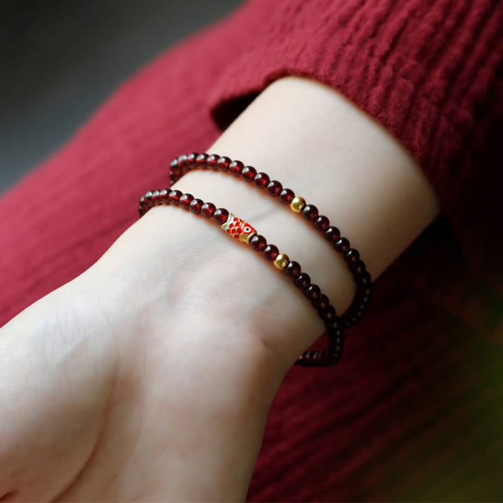 Braccialetto di protezione in granato naturale con pesce koi in oro 999 Buddha Stones - image 9