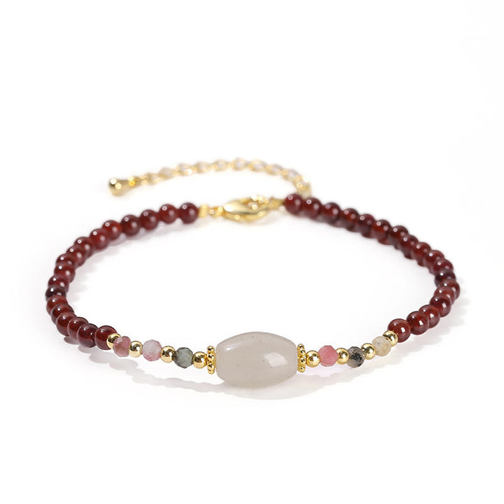 Bracciale Buddha Stones con perline di giada, tormalina e granato